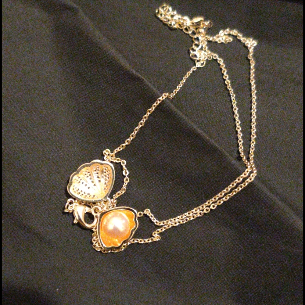 Gold plated pearl in shell necklace